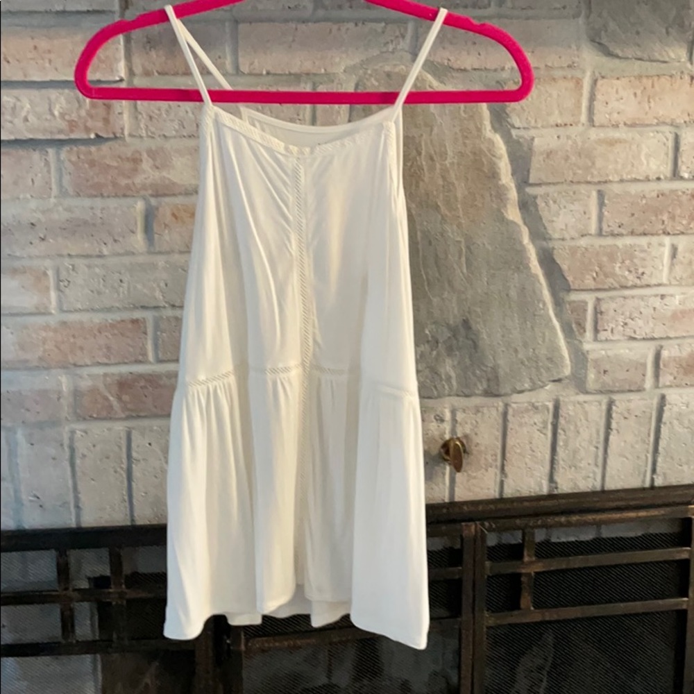 high-neck peplum AE top with eyelet detail